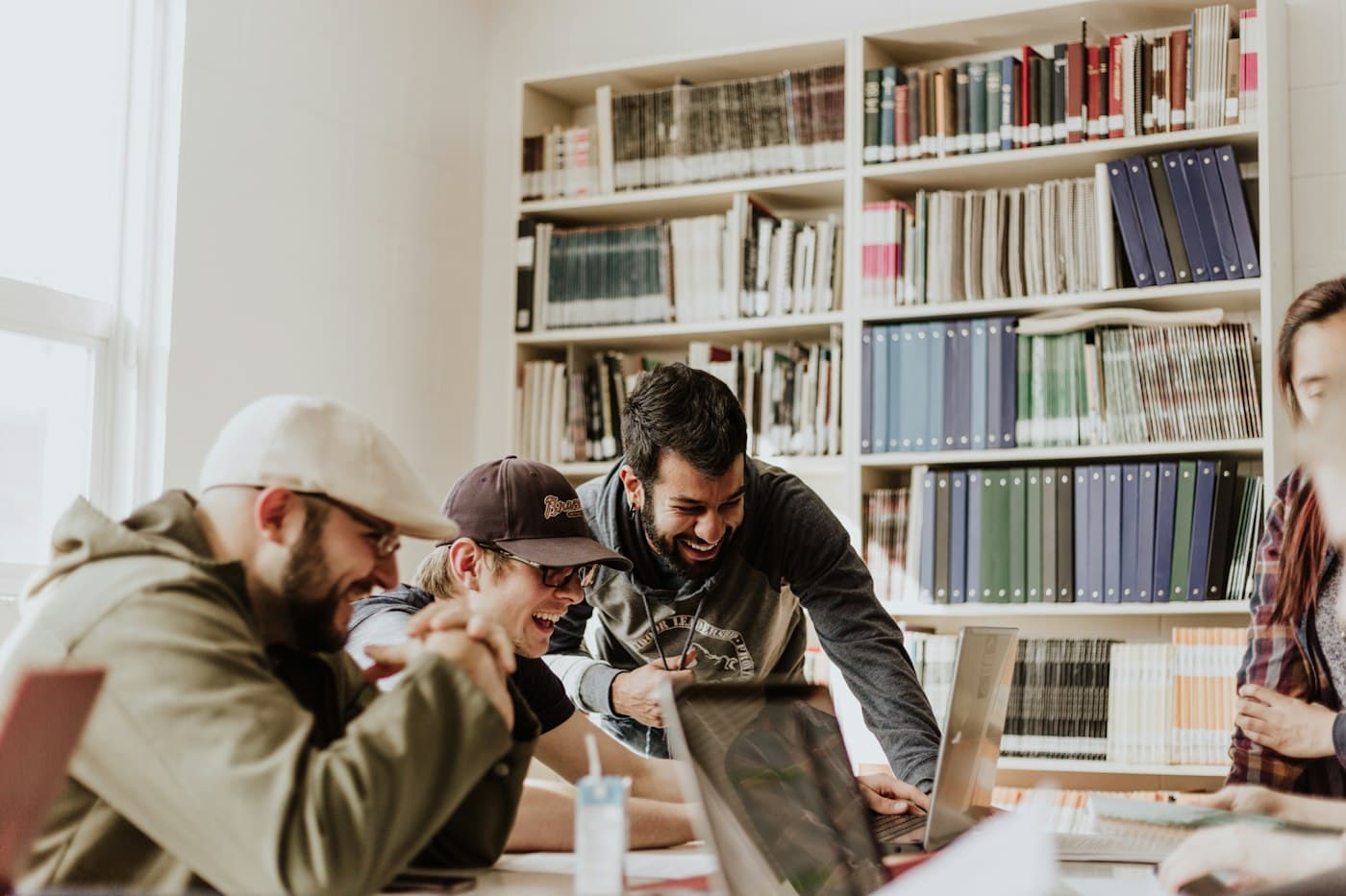 Students working together around a library table