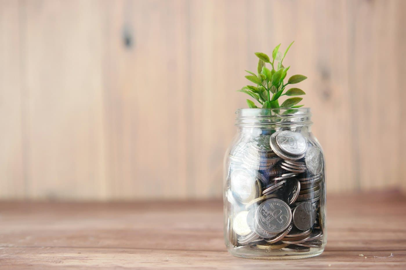 Coins collected in a glass jar